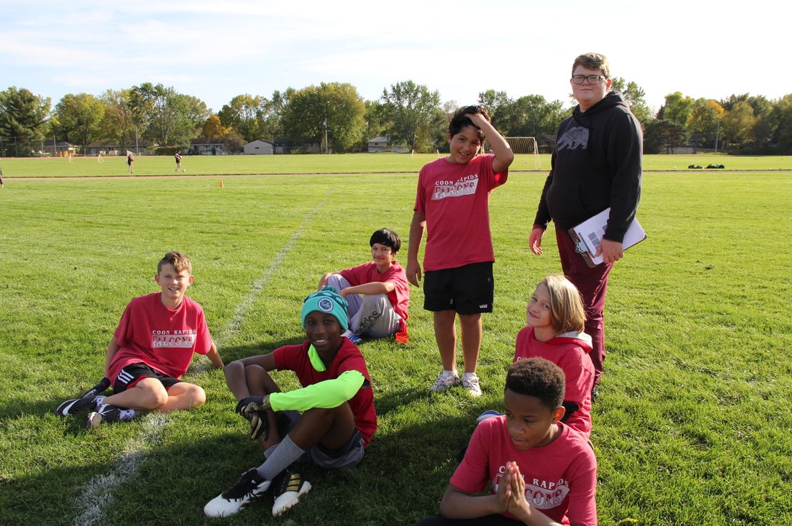 Coon Rapids Falcons on the sidelines at flag football game 